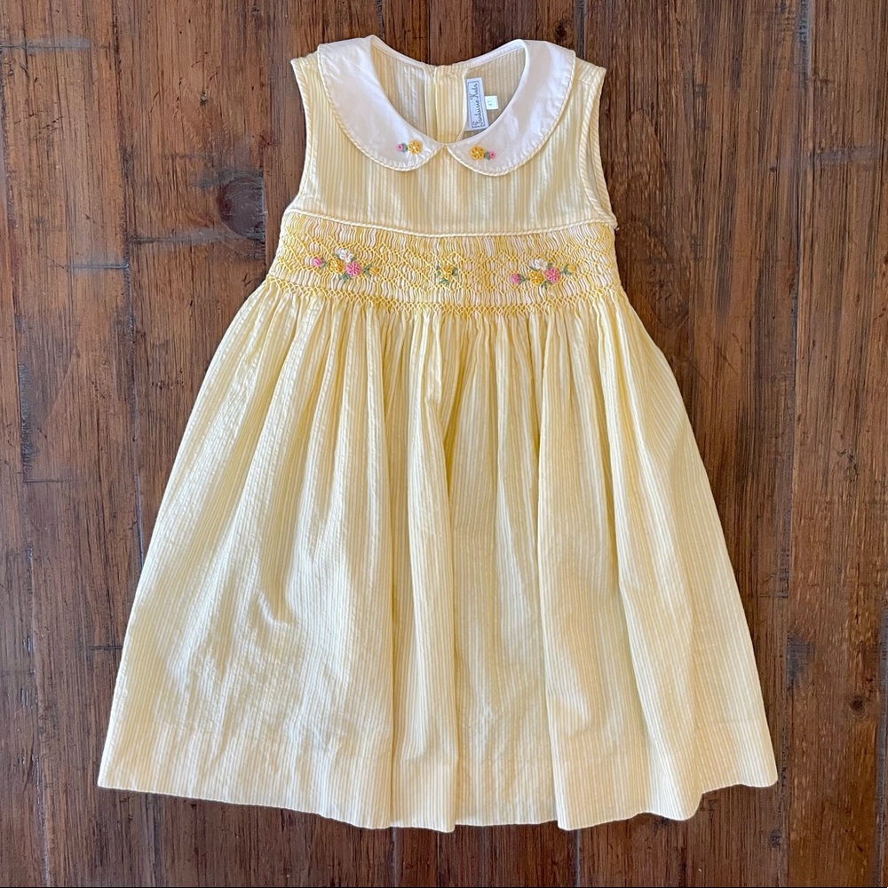 Fantaisie Kids Smocked yellow pinstripe dress with Peter Pan collar.